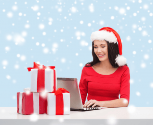 Christmas woman with holiday wrapped presents, image from Shutterstock