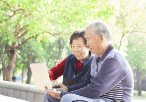 Image from Shutterstock, couple looking at laptop screen