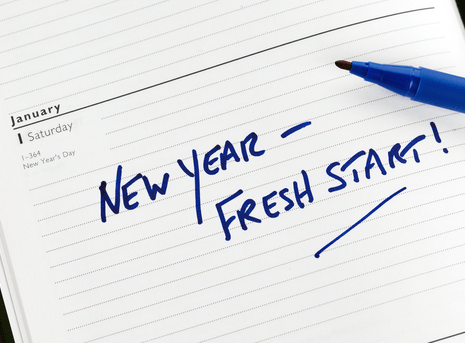 Image of desk calendar on Jan 1 with the notation New Year, Fresh Start