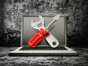 laptop-computer-with-wrench-screwdriver-tools-image-from-shutterstock