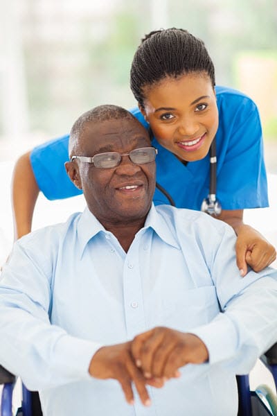 elder-care-giver-with-man-in-wheelchair-