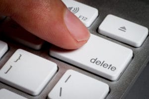 finger-pressing-delete-key-on-keyboard-image-from-shutterstock
