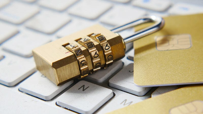 A padlock on a keyboard, next to two gold credit cards.
Caption: You will be able to repel a large number of hackers if you have strong passwords. - image licensed from unsplash.com