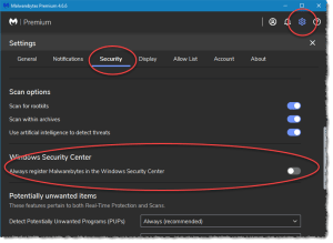 This is a screenshot of the Malwarebytes Settings > Security tab showing where to turn off the default setting for registering Malwarebytes in the Windows Security Center.